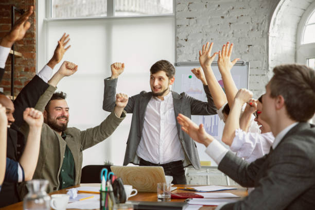 istock Group of young business professionals having a meeting, creative office 1200978725