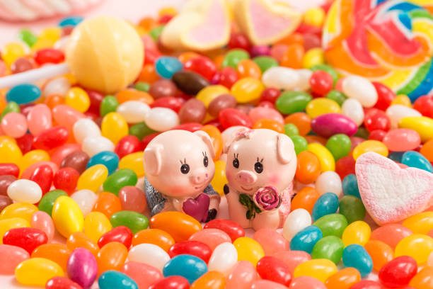 A pair of piggy dolls in many candies