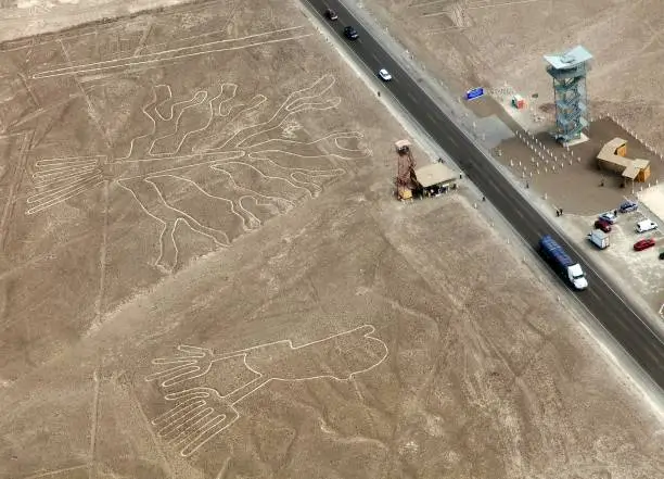 Tree and hands geoglyphs, Nazca mysterious lines and geoglyphs aerial view, landmark in Peru