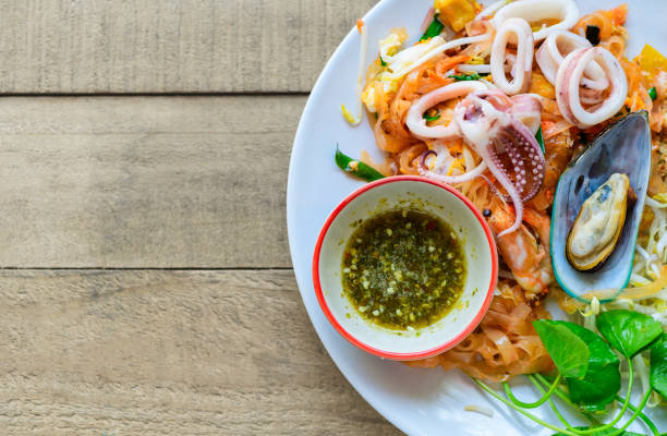 istock Stir-fried rice noodles (Pad Thai) with shrimp, mussels and squid. 1200979026