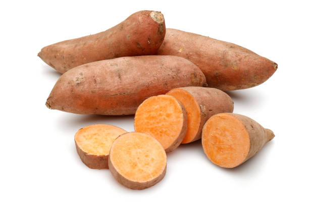 istock Sweet potatoes with slices isolated on white 1200980512