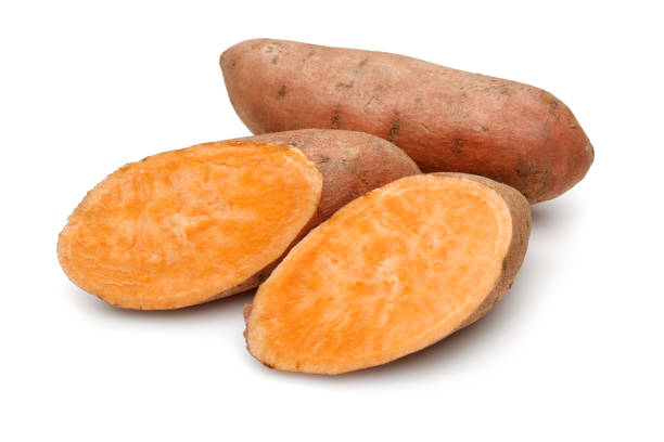 istock Sweet potatoes with slices isolated on white 1200980609