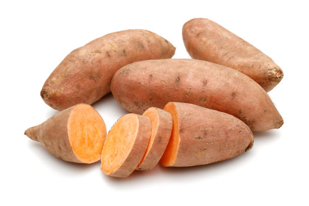 istock Sweet potatoes with slices isolated on white 1200980733