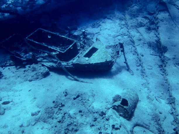 istock Underwater landscape, dirty bottom, boat and chains, clean blue Red sea 1200981565