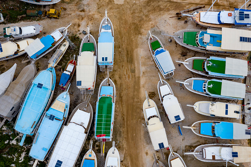 Boats to be rapaired at a shipyard. Taken via drone