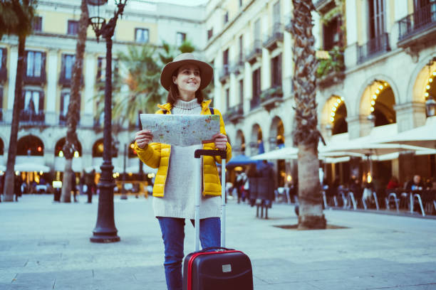 istock Woman in Barcelona reading a map 1200982837