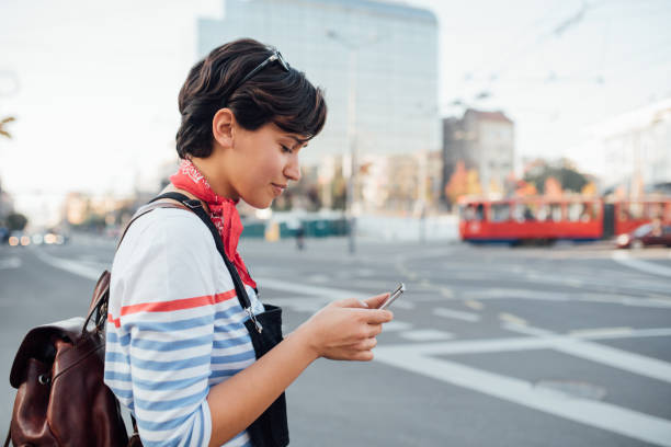 istock Young woman calling for taxi 1200982871