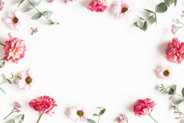 istock Flowers composition. Frame made of pink flowers and eucalyptus branches on white background. Valentines day, mothers day, womens day concept. Flat lay, top view 1200983725
