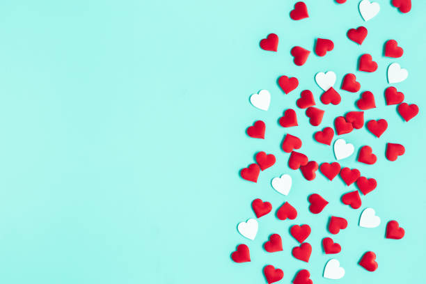 istock Valentine's Day background. Red hearts on pastel blue background. Valentines day concept. Flat lay, top view, copy space 1200983795