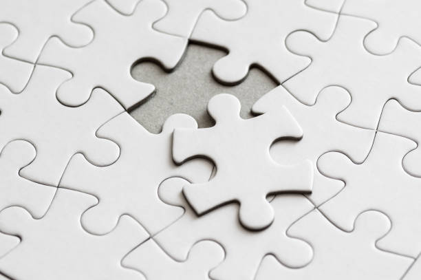 istock Blank jigsaw puzzles with one piece on the side 1200984260