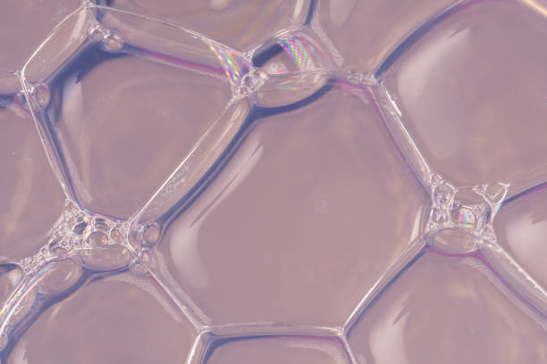 istock Transparent and voluminous soap bubbles on a blue-silver background 1200984493