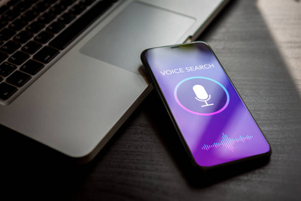 istock Voice search technology, sound recognition, siri speech detect and deep learning concept. Application with microphone and wave icon on mobile phone screen. 1200984504