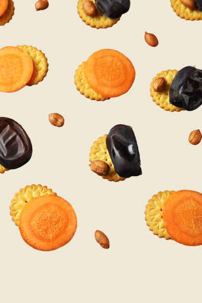 istock Healthy snacks pattern – cookies, dates, raw carrots and peanuts 1200985543