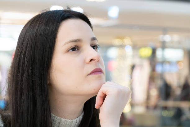 istock Young brunette woman, close-up portrait 1200986842