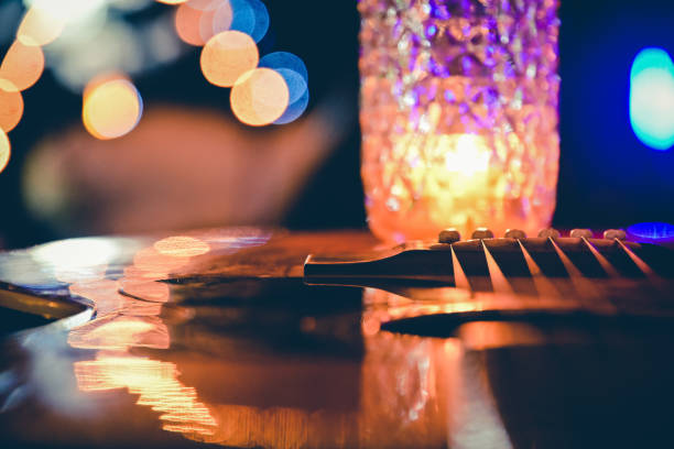 Close up guitar line on lights bokeh background soft focus for romantic song background Close up guitar line on lights bokeh background soft focus for romantic song background. bfg stock pictures, royalty-free photos & images