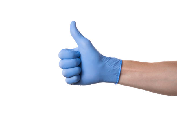承認。白い背景に青い医療用手袋を持つ手。手の内側 - doctor male white scientist ストックフォトと画像