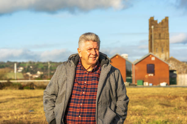 istock Senior man standing on wasteland 1200989921