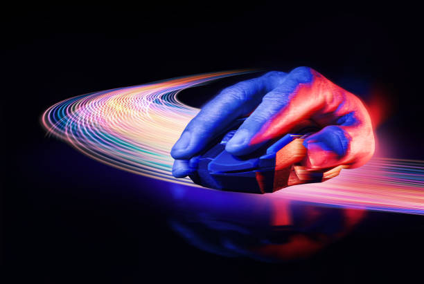 Human Hand moving the High technology computer gaming mouse over the lazor curve light