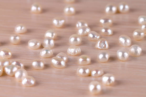 istock The white river pearls are scattered on the table. 1200992217