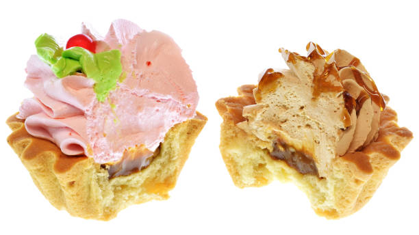 istock Two bitten tartlet cake with strawberry cream and carame 1200993351