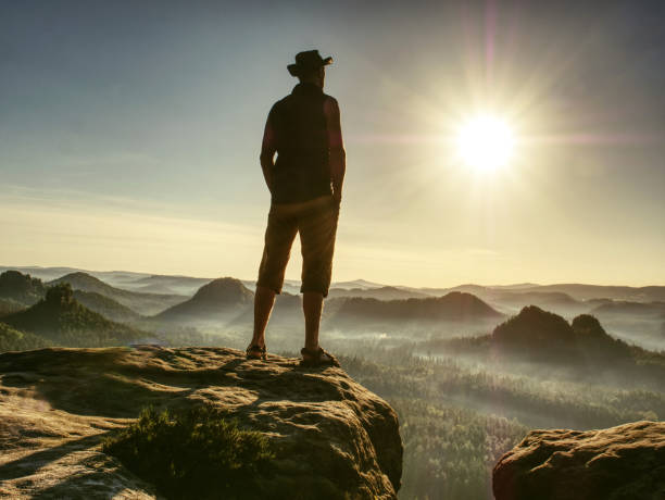 istock Tall man feel free above large Valley wearing cowboy hat 1200993675