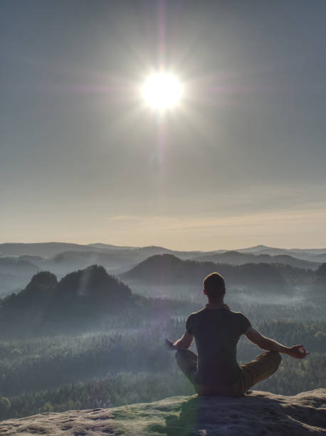 istock Sitting trekker in cowboy hat enjoy view with mountain Sunrise. 1200993693