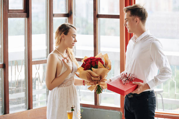 istock Guy Giving Gifts On Date 1200994965