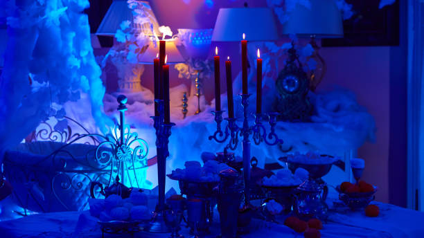 istock Table setting with candles, marshmallows and tangerines. Holidays, catering and hospitality concept. 1200995415