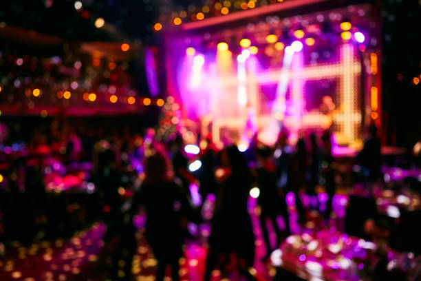 istock Crowd up in front of bright stage. Blurred background. 1200995476
