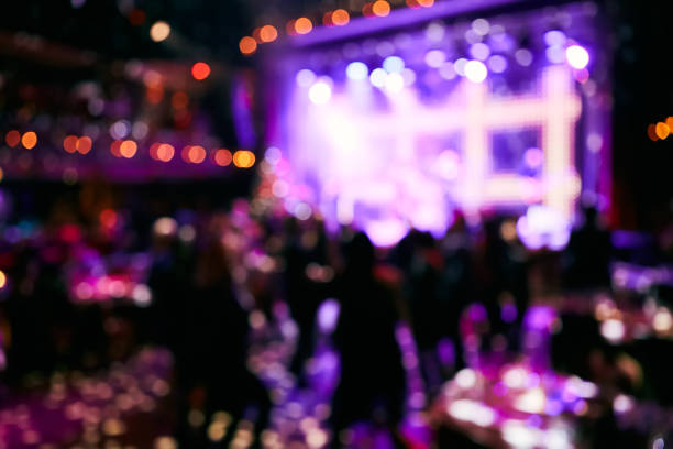 istock Crowd up in front of bright stage. Blurred background. 1200995510