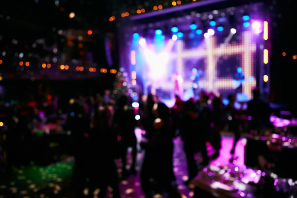 istock Crowd up in front of bright stage. Blurred background. 1200995524