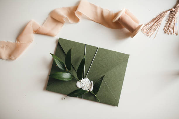 Green modern recycled paper wedding invitation on white background
