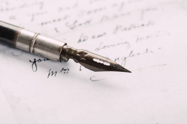 istock fountain pen on paper with ink text closeup 1200997646