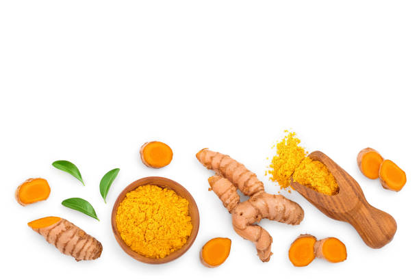 istock Turmeric powder and turmeric root isolated on white background with copy space for your text. Top view. Flat lay 1200997989