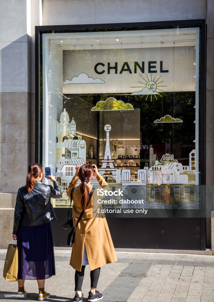Two Asian Women Photographing The Chanel Store On Champselysees