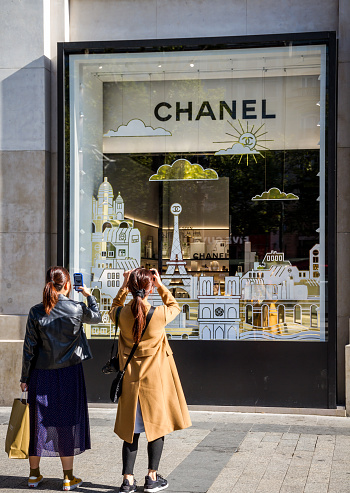 Two Asian Women Photographing The Chanel Store On Champselysees Avenue Stock  Photo - Download Image Now - iStock