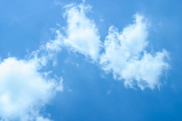 Clouds in a blue sky Clouds in a blue sky metcast stock pictures, royalty-free photos & images