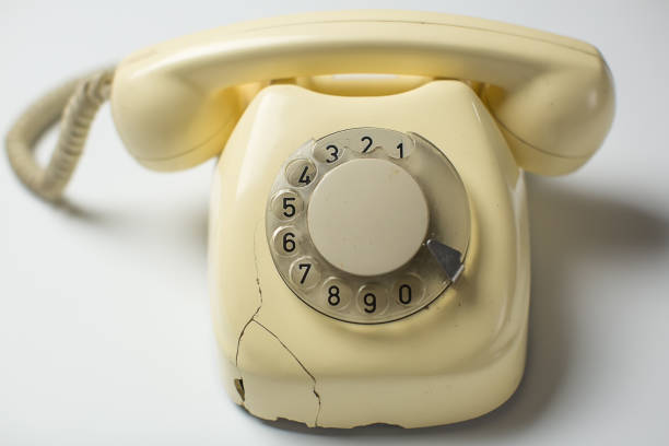 istock Retro rotary telephone with cracks and broken parts 1200999600