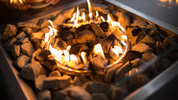 istock Small fireplace on the table in the nearby coffee bar 1201000339