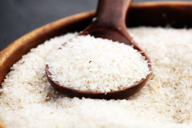 istock Portion of Psyllium Seeds on rustic dark background. Psyllium seed husks on wood 1201001633