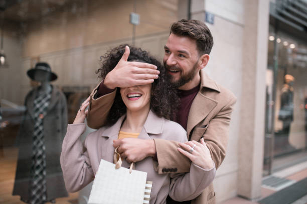 istock Boyfriend surprise his girlfriend for a Valentine's day with a present 1201001774