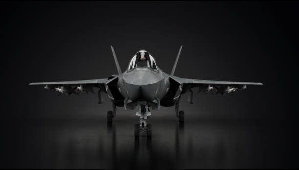 F-22 aircraft fighter jet in undisclosed location in hangar facing front 3d render stock photo