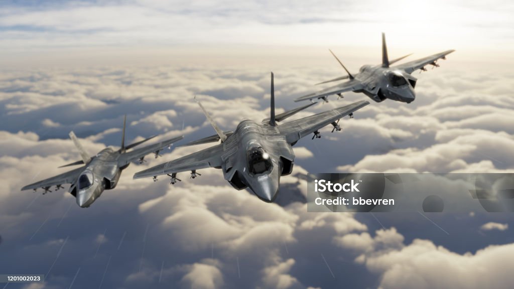 Three F-35 fighter jets flying over clouds in vic formation 3d render Fighter Plane Stock Photo