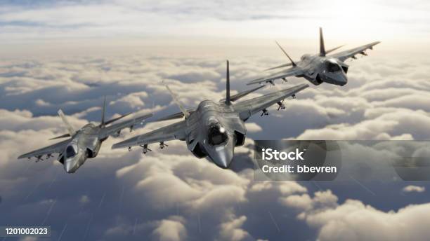 Three F35 Fighter Jets Flying Over Clouds In Vic Formation 3d Render Stock Photo - Download Image Now
