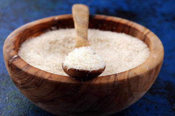 istock Portion of Psyllium Seeds on rustic dark background. Psyllium seed husks on wood 1201002320