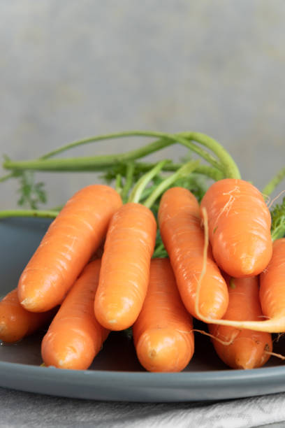 istock Raw fresh carrots, biological agricultural production 1201002631