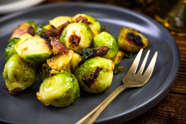 istock Fried or Roasted Brussels Sprouts with Bacon. Chrstmas Festive Healthy Dish 1201003491