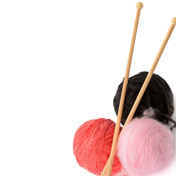 istock Balls of wool and knitting needles isolated on white background. Free space for text. 1201005371