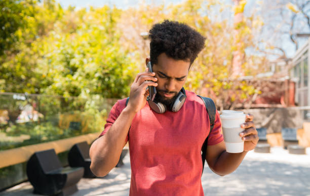 istock Young afro man talking on the phone. 1201005582
