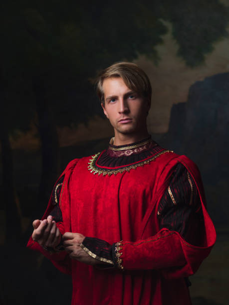 handsome man in a Royal red doublet handsome man in a Royal red doublet. Young man, portrait in Renaissance style paintings renaissance dress stock pictures, royalty-free photos & images